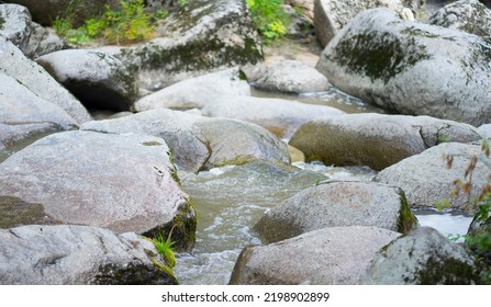 View Of A Mountain Stream That Flows Between The Stones