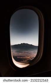 View of the mountain through the window of the plane. High quality photo