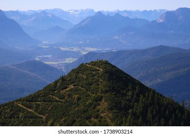 View Of Mountain With Zig Zag Path With Tiny View Of People At The Spot With Cross 