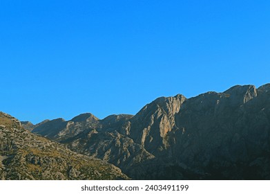 View of the mountains and blue cloudless sky
