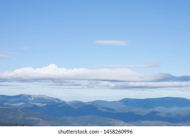 view of the mountains with clouds