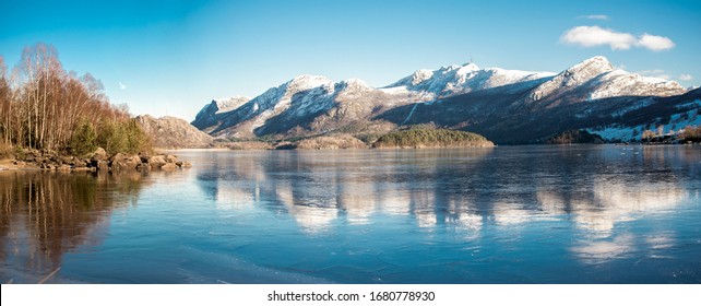 A view of mountains covered by snow at Oltedalsvatnet lake during winter season, Gjesdal commune, Norway, February 2018 - Powered by Shutterstock