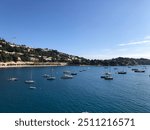 View from the mountains of France on the coastline of a French Riviera coastline with boats in the water