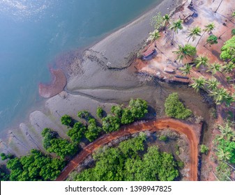 View Of The Mountains And The Indian Ocean From A Bird's-eye View, A Drone From A Height Of 300 M. Orange Rocks, Ways, Trees And Bright Blue Water.