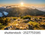 View of mountains over clouds from Pico Ruivo on sunset. Madeira island, Portugal