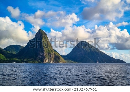 A view of the mountains from Petit Piton on St. Lucia in the Caribbean under blue skies