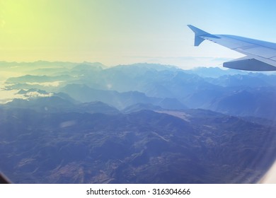 View Of Mountains From A Plane Window