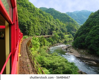 A view of mountains and river from the "Romantic Train" outside of Kyoto, Japan