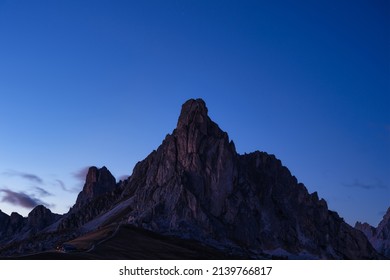 View of the mountains silhouette and high cliffs during sunset. Natural landscape. Sky and rocks. Photo in high resolution.