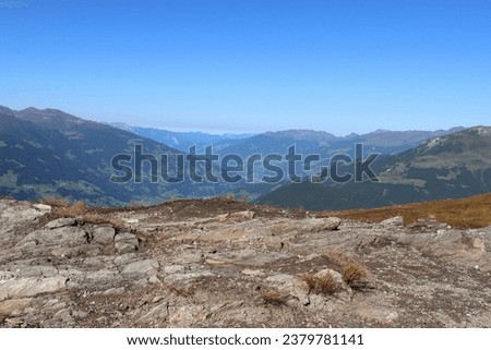 view of the mountains of the Zillertal and rocky ground in the foreground