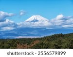 View of Mt Fuji taken from Mishima Skywalk suspension bridge. Taken during autumn fall foliage season. Famous tourist attraction in Mishima, Shizuoka, Japan