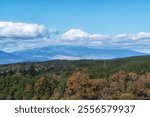 View of Mt Fuji taken from Mishima Skywalk suspension bridge. Taken during autumn fall foliage season. Famous tourist attraction in Mishima, Shizuoka, Japan