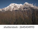View of Mt.Annapurna South (7,219 m) and Mt.Hiunchuli (6,441 m) seen from Mardi Himal view point in the Annapurna region of Nepal. 