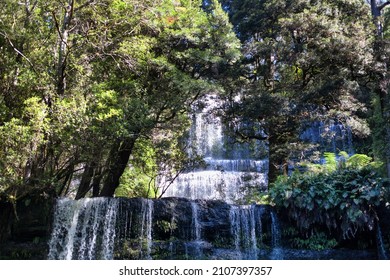 View Of Multi Tiered Waterfall Cascading Down Through The Tasmanian Forest