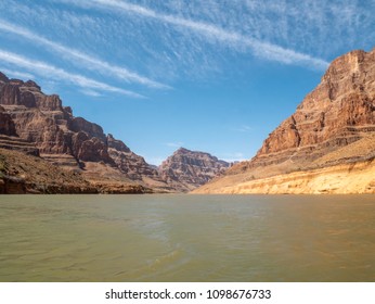 View of Multiple Airplane Trail Marks in the Sky from the Colorado River