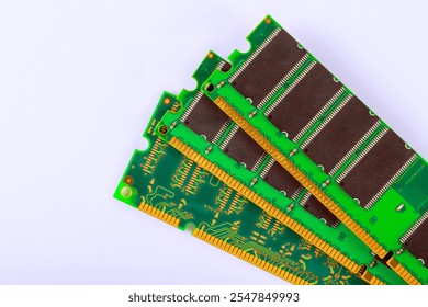 View of multiple RAM modules displayed on light surface, highlighting intricate circuit patterns memory chip arrangements, emphasizing technology engineering.