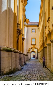 view of a narrow corridor inside of the mel abbey in austria
