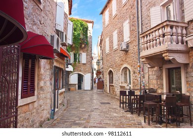 view narrow street in old district of Budva, Montenegro - Powered by Shutterstock