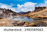 View of natural Hot Springs at Hot Creek Geological Site. Located near Mammoth Lakes, California, United States. Blue Sky Sunny Day Colorful 