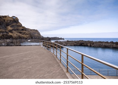 View to the natural rock pool complex in Seixal. Madeira Island, Portugal - Powered by Shutterstock