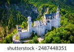 A view of Neuschwanstein Castle,  a 19th-century fairy-tale-like palace perched on a rugged hill above the village of Hohenschwangau in southwest Bavaria, Germany, Europe