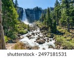 View of Nevada Mountains and Falls from the Mist Trail in Yosemite National Park. Summer Vacation in California, USA.