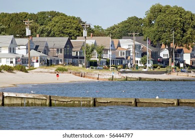 View Of The New England Coastline With A Long Row Of Beach Cottages.