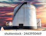 View of the new installation crude oil storage tank in the tank farm. Above ground storage tanks can be used to hold materials such as petroleum, waste matter, water, chemicals, and hazardous material