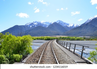 A View Of New Zealand’s Southern Alps From The Rails Of The Trans-alpine Train Route.