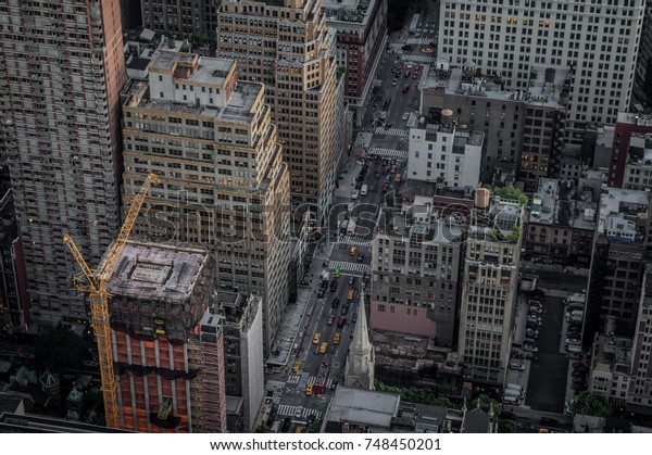 A view of the New York City streets from an aerial\
point of view.