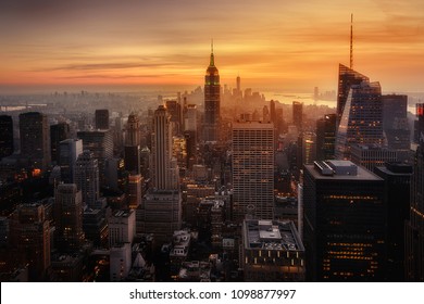 View Of New York City From The Top Of One Of Its Viewpoints, Capturing The Warm Light Of Sunset