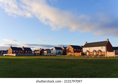 view of newly built houses in the edge of town at sundown.