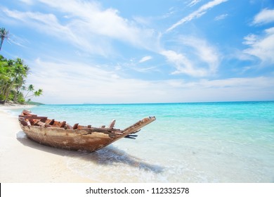 View of nice tropical  beach  with old boat