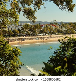 View Of Noosa Heads Main Beach, Framed Through Trees - Sunshine Coast, Queensland, Australia