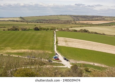 View North Over South Downs Countryside From Cissbury Ring Near Worthing, West Sussex, England. With Small Car Park And Walkers.