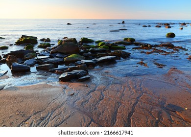 View Of The North Sea With Sand Patterns In The Foreground, Runswick Bay, North Yorkshire, England, UK.