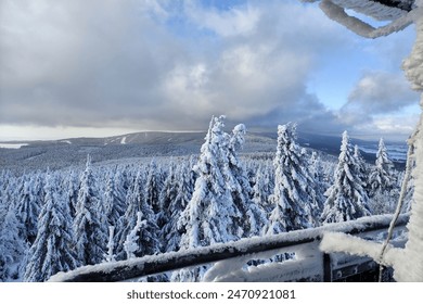 View from the observation tower. Snowy landscape in the Sudeten mountains. Trees covered in snow and frost. A winter adventure, exploring central Europe. Natural beauty. - Powered by Shutterstock