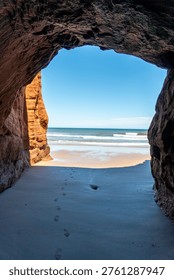 View of the Ocean and Beach Through a Sea Cave, Magdalen Islands, Quebec, Canada