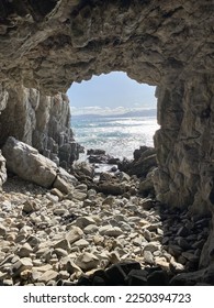 View of ocean from inside a cave.