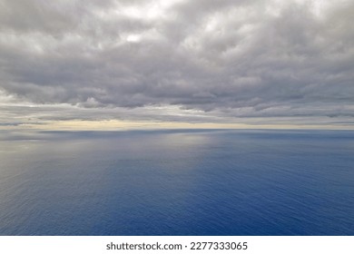 View of the ocean and overcast skies. The background of nature
