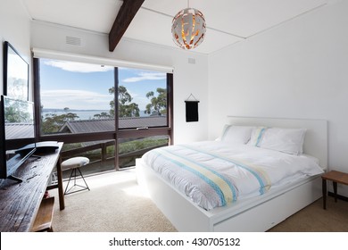 View Of The Ocean From A Retro Beach House Bedroom In Australia