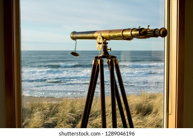 View of the ocean through a window with telescope.
(Oregon coast)
