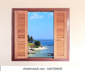 View of ocean through window with wooden shutters. Sea view room. Travel, resort , vacation and holiday concept. Beautiful tropical sea view at window in resort