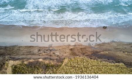 view of the ocean waves and sandy beach