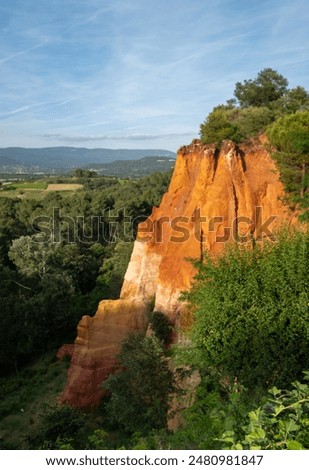 View of ochre cliffs and surrounding landscape, photographed from the historic town of Roussillon, Provence in the south of France.