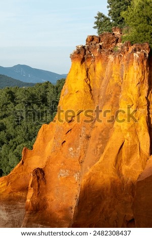 View of ochre cliffs and surrounding landscape, photographed from the historic town of Roussillon, Provence in the south of France.