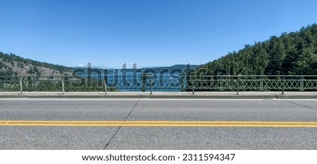 View off of Deception Pass Bridge with Mount Baker on the horizon