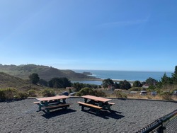View Off The Marine Mamal Center In Sausalito, CA.  Beautiful Ocean View With The Trees In The View As Well As Some Picnic Tables.