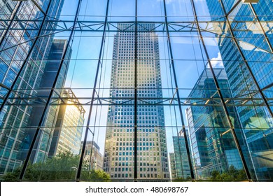 View Of Office Buildings Through Glass Window In Canary Wharf, Financial District Of London