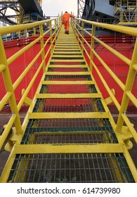 View Of An Offshore Crew Walking At The Gangway To Offshore Drilling Rig. 